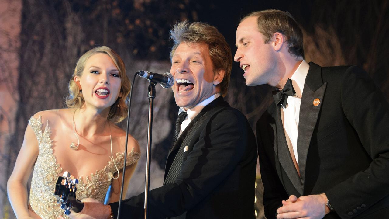 Prince William sang with US singers Taylor Swift and Jon Bon Jovi in 2013. Picture: AP Photo/Dominic Lipinski
