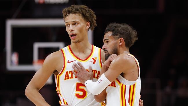 Dyson Daniels and Trae Young. (Photo by Todd Kirkland/Getty Images)