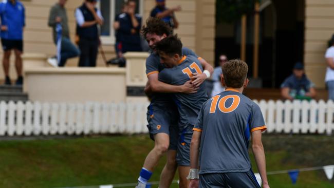 Levi Collins and Xavier Veivers Brown celebrate.