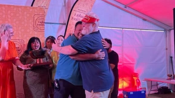 Golden Bowl 2024 winning restaurateurs Romal Shrestha (Bamboo Lounge) and Jason Hanna (Chow) embrace after being announce joint winners, the first such occurrence in the Darwin International Laksa Festival's history. Picture: Facebook