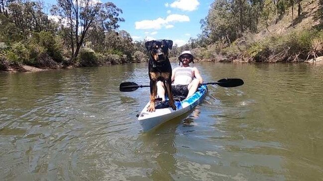 Alister MacPhee and his dog before being the pair were attacked by a big croc on the Bloomfield River on Wednesday, February 22. Picture: Facebook