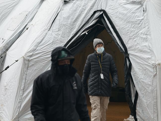 Workers build a makeshift morgue outside of Bellevue Hospital in New York to handle an expected surge in coronavirus victims. Picture: AFP