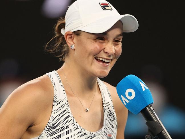 Australia's Ashleigh Barty takes part in an interview on court after beating Jessica Pegula of the US in their women's singles quarter-final match on day nine of the Australian Open tennis tournament in Melbourne on January 25, 2022. (Photo by Martin KEEP / AFP) / -- IMAGE RESTRICTED TO EDITORIAL USE - STRICTLY NO COMMERCIAL USE --