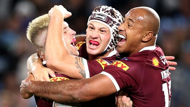 *2022 Pictures of the Year Australia* - SYDNEY, AUSTRALIA - JUNE 08: (L-R) Cameron Munster, Kalyn Ponga and Felise Kaufusi of the Maroons celebrate victory at full-time during game one of the 2022 State of Origin series between the New South Wales Blues and the Queensland Maroons at Accor Stadium on June 08, 2022, in Sydney, Australia. (Photo by Mark Kolbe/Getty Images)