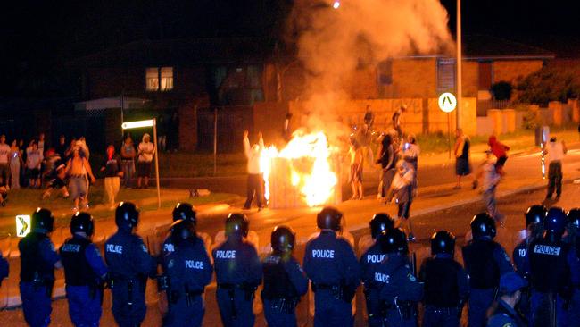 Youths riot in the streets of Macquarie Fields in 2005.