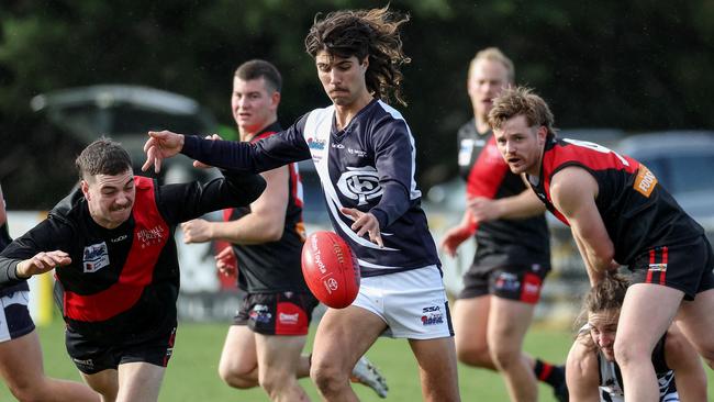 RDFL: Melton Centrals’ Adam Tomac gets the clearance. Picture: George Sal