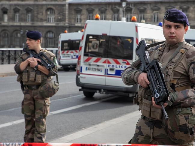 Military personnel block the bridge near Paris Police headquarters after four officers were killed in a knife attack. Picture: Getty