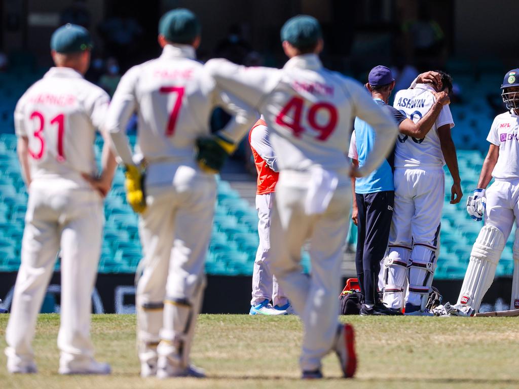 India's Ravichandran Ashwin reacts after being hit by a ball.