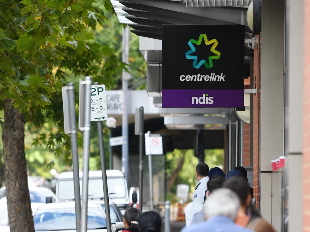 A queue outside a Centrelink office. Picture: David Mariuz/AAP