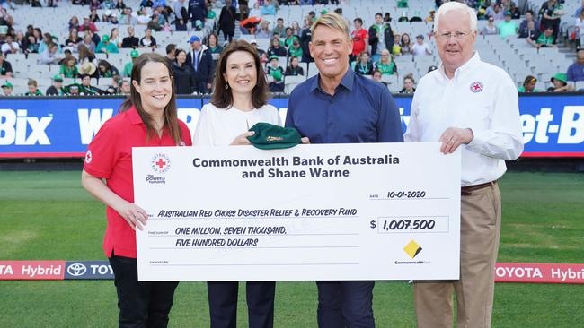 Shane Warne with Red Cross volunteer Anna Moriarty (left) Monique Macleod of the Commonwealth Bank of Australia and Ross Pinney, President of the Australian Red Cross.