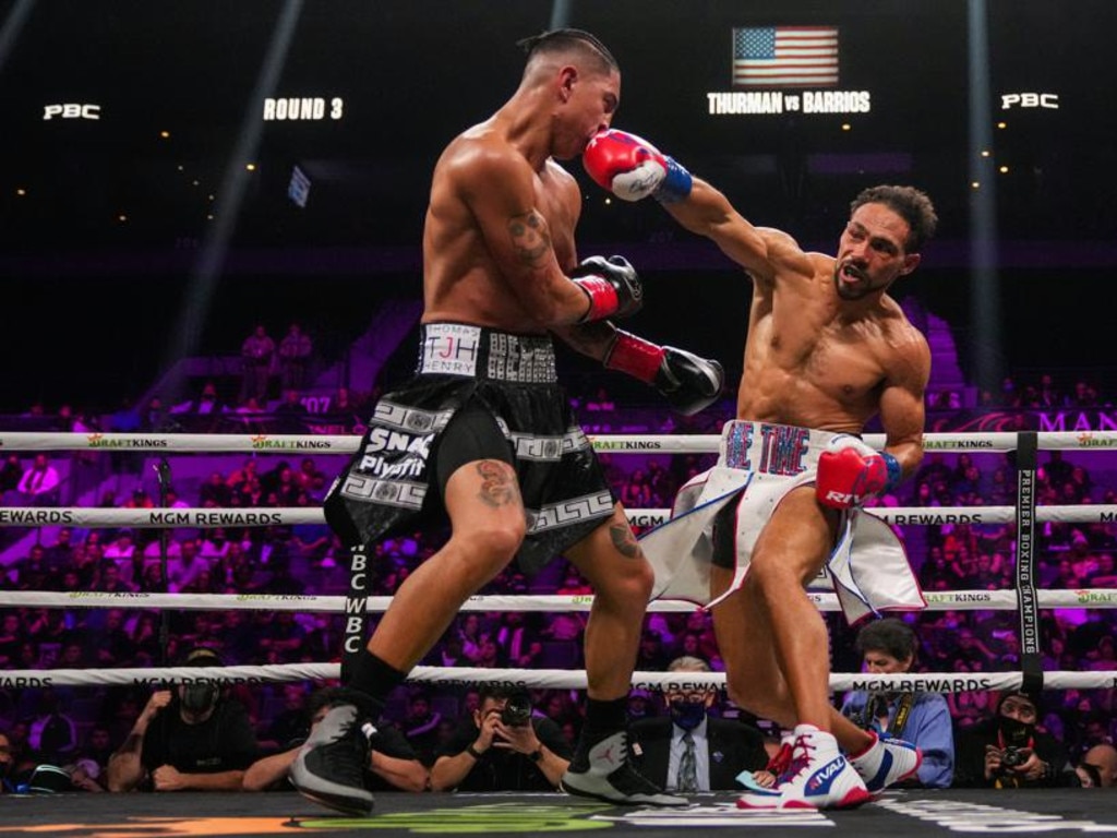 Mario Barrios (L) takes a right from Keith Thurman during a welterweight bout. Picture: Getty Images