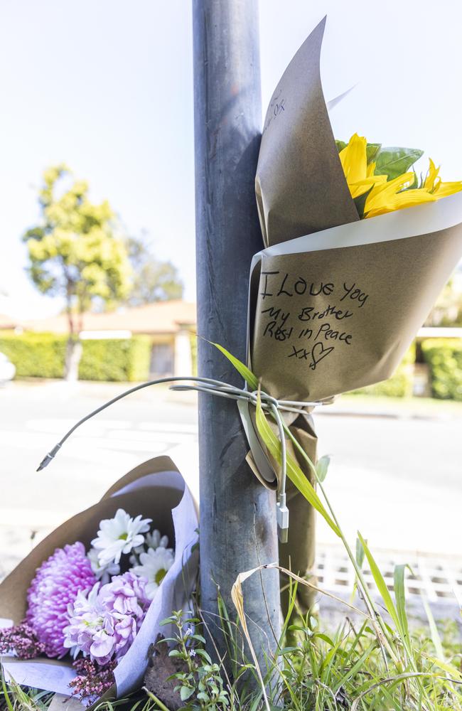 Flowers left at the scene of the stabbing murder outside a Brisbane gym on Monday. Picture: Matthew Poon