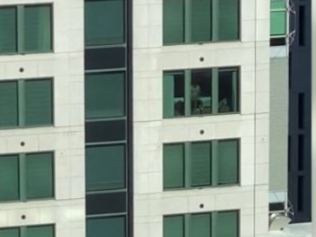 Sydney couple have public sex in CBD hotel with blinds open: Video ...