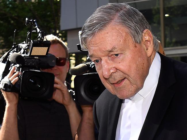 Cardinal George Pell walks to a car in Melbourne on December 11, 2018. - Pell is facing prosecution for historical child sexual offences. (Photo by William WEST / AFP)