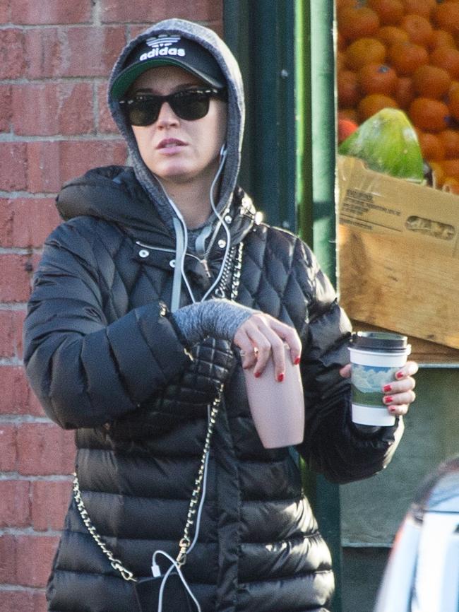 Katy Perry with a couple of coffees. Picture: Splash News