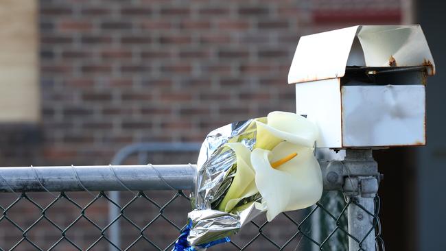 Tributes outside of a house at Saladin Circle Clarendon Vale where the body of Michelle Louise Meades was found. Picture: Nikki Davis-Jones