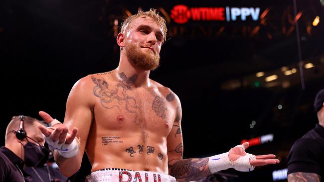 Jake Paul reacts to knocking out Tyron Woddley. Photo by Mike Ehrmann/Getty Images