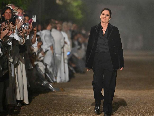 Maria Grazia Chiuri smiles at the end of the Dior Women Cruise 26 fashion collection show at Villa Albani Torlonia, in Rome on May 27, 2025. (Photo by Andreas SOLARO / AFP)