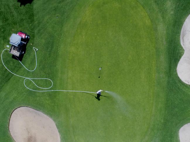 Pennant Hills Golf Course greenskeeper Spencer Davison tries to keep the greens well watered as temperatures reach the high 30’s in Sydney’s west today. Picture: Toby Zerna/ Supplied