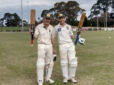 Glen and Jordan Furhmann raise their bats after putting on 369 unbroken. Picture: Supplied