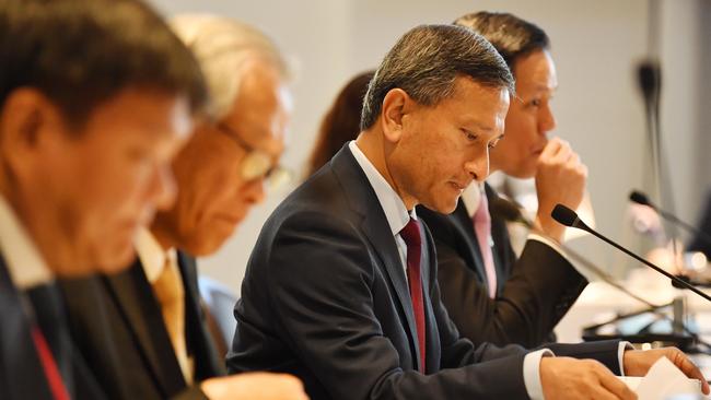 Vivian Balakrishnan, centre, told parliament “appropriate sanctions and restrictions” would be imposed to block some Russian banks and financial transactions.