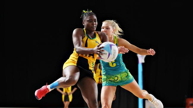 Adean Thomas of Team Jamaica (L) wins the ball ahead of Kate Moloney