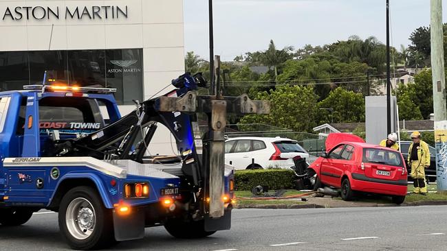 A stolen Hyundai Getz mounted the kerb and ended up on the footpath after smashing through a traffic light on Nerang Rd and Minnie St at Southport. Picture: Andrew Potts