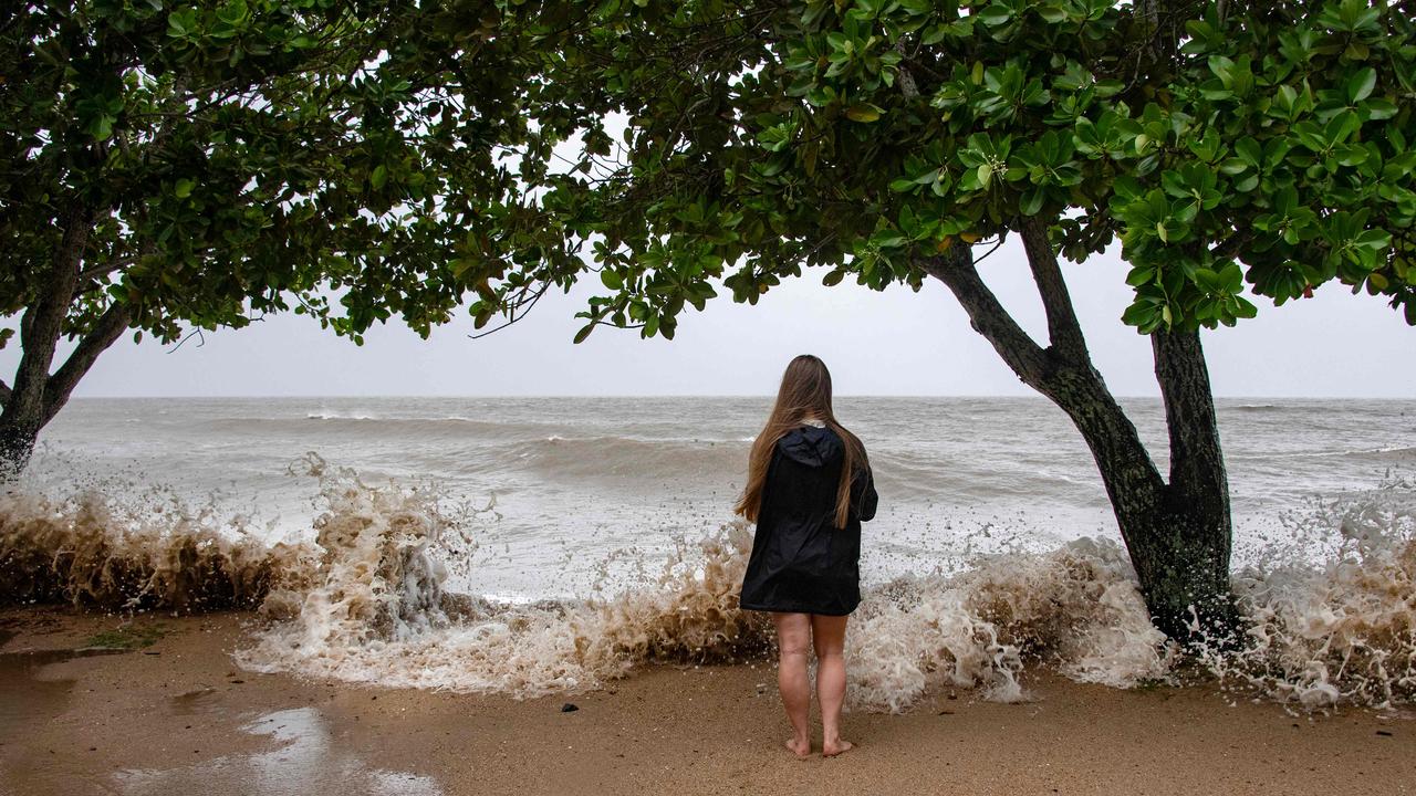 Holloways Beach resident Lisa Methven watches the storm across the Coral Sea as Cyclone Jasper approaches landfall in Cairns. Picture: Brian Cassey