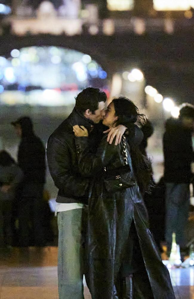 The loved-up couple shared a kiss in front the breathtaking view of the Eiffel Tower. Picture: BACKGRID