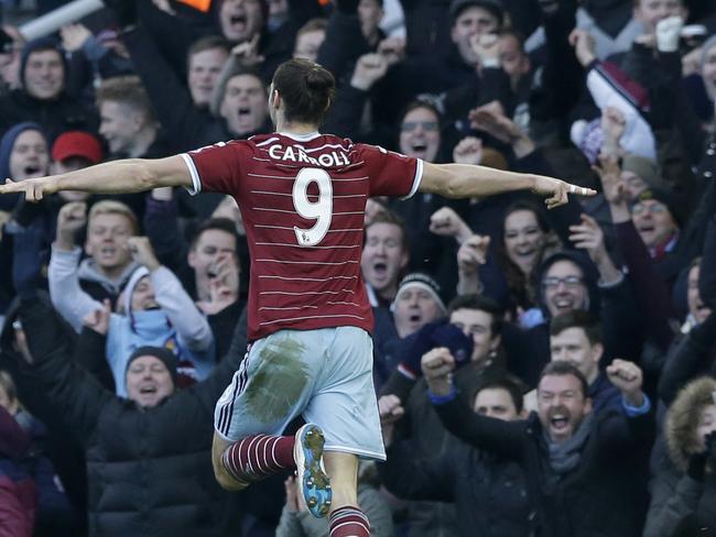 West Ham's Andy Carroll celebrates scoring his side's first goal during the English Premier League soccer match between West Ham United and Hull City at Upton Park stadium in London, Sunday, Jan. 18, 2015. (AP Photo/Matt Dunham)