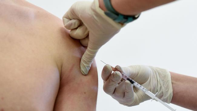 Territorians are being urged to get vaccinated. (Photo by Yuri DYACHYSHYN / AFP)