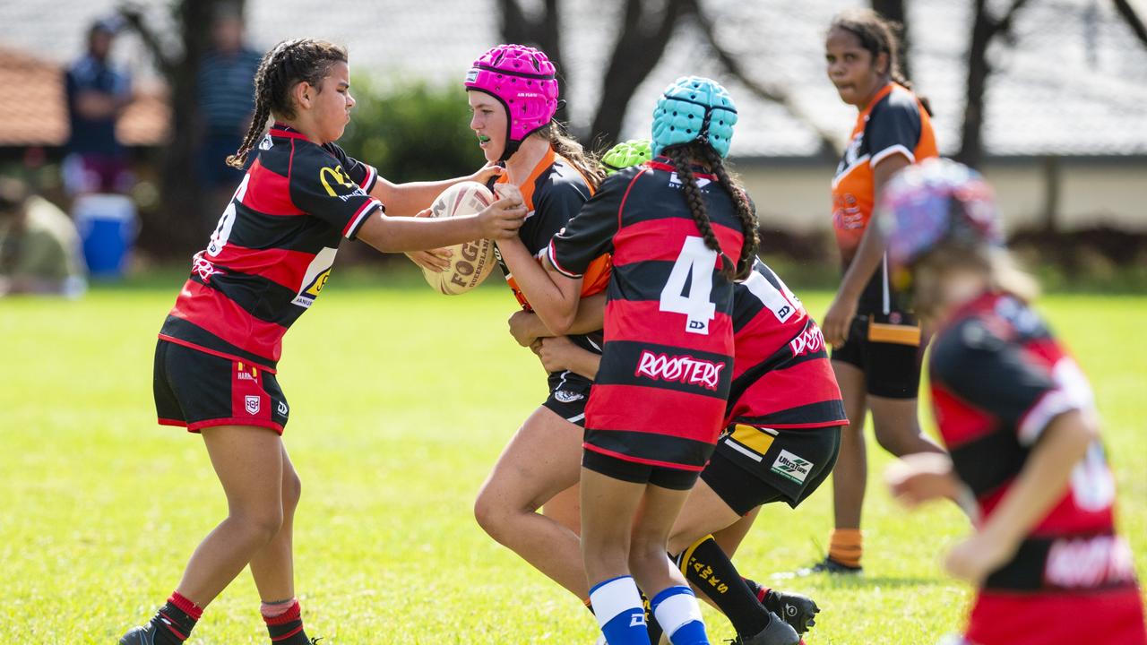 Tayla Thomas (left) tackles a Souths player. Picture: Kevin Farmer