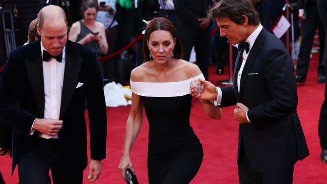 Kate holds Tom Cruise’s hand while husband Prince William looks on. Picture: Getty