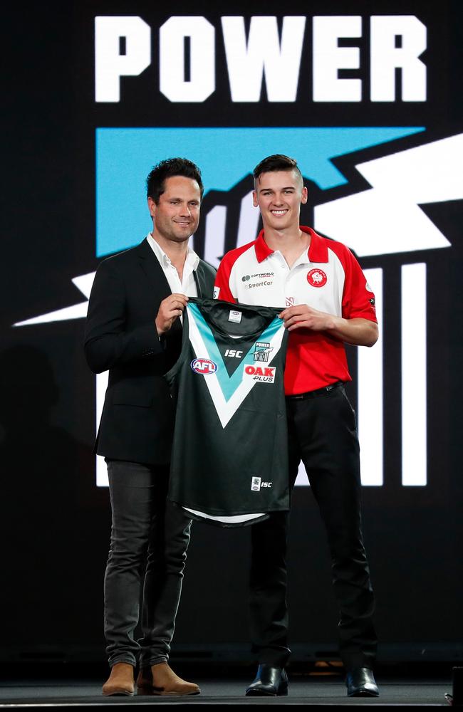 Port Adelaide's pick number 5 Connor Rozee (right) poses with Gavin Wanganeen during the 2018 NAB AFL Draft at Marvel Stadium. Picture: Getty Images