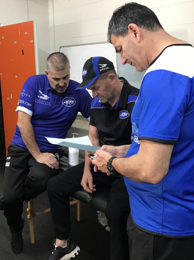 Head coach Greg Matterson (centre) with trusted colleagues in the Henson Park sheds. Picture: Supplied