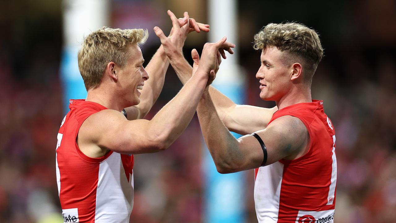 SYDNEY, AUSTRALIA - JUNE 24: IsaacÂ Heeney of the Swans celebrates kicking a goal with ChadÂ Warner of the Swans during the round 15 AFL match between Sydney Swans and West Coast Eagles at Sydney Cricket Ground, on June 24, 2023, in Sydney, Australia. (Photo by Cameron Spencer/Getty Images)