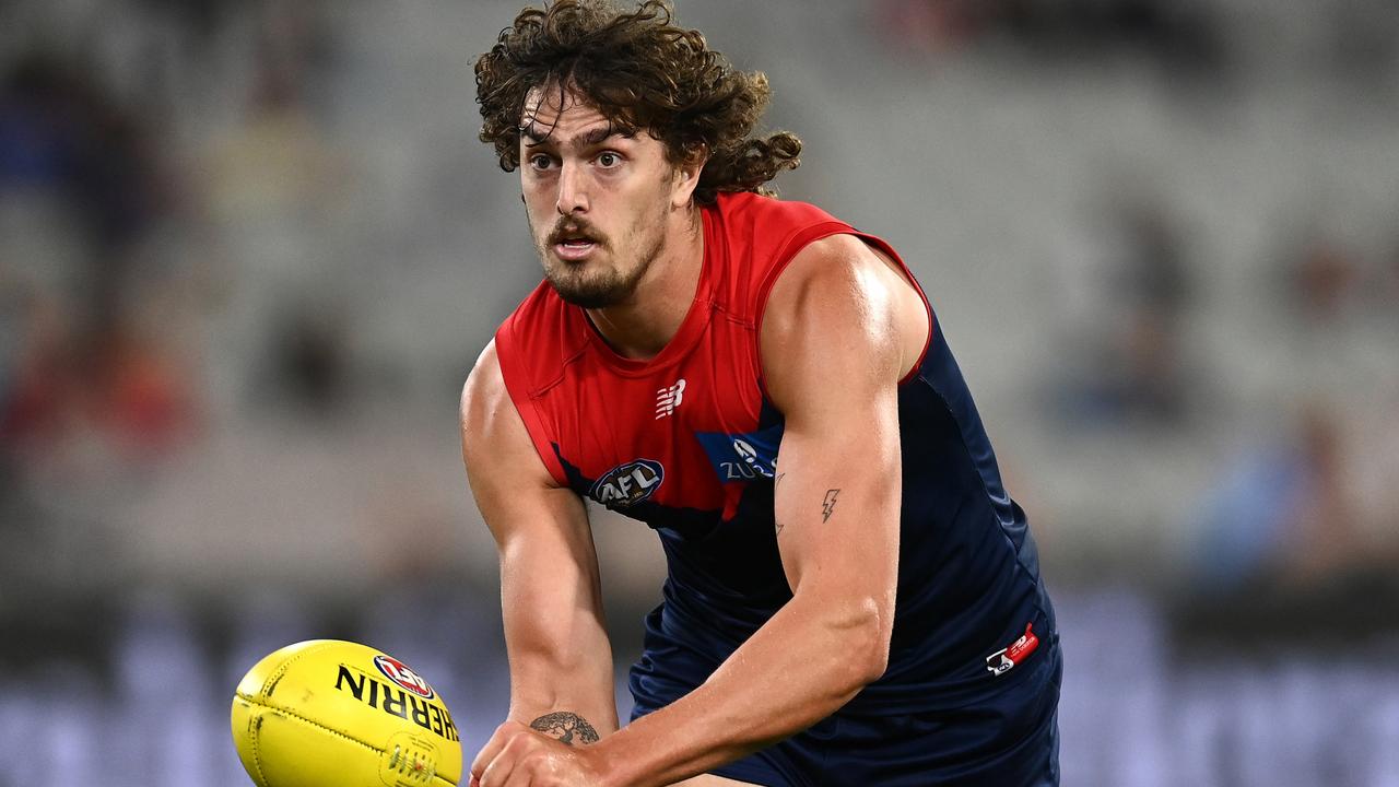 Luke Jackson handballs during the Demons’ demolition of Greater Western Sydney.