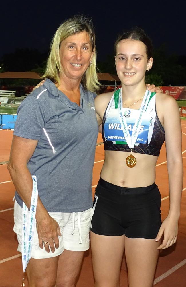 Ipswich and District Athletic Club achiever Monique Williams receives her North Queensland Championships medal from 1984 Olympic heptathlon gold medallist Glynis Nunn. Picture: Vic Pascoe