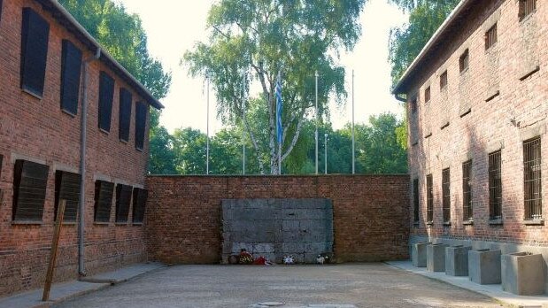 In the middle of this photograph is the Death Wall where shooting executions took place. Block 11 on the right and Block 10, where women lived, victims of sterilisation experiments of Dr Carl Clauberg on the left. At the Auschwitz-Birkenau memorial and museum – a former German Nazi concentration and extermination camp in Poland. Picture: Pawel Sawicki/auschwitz.org photo gallery