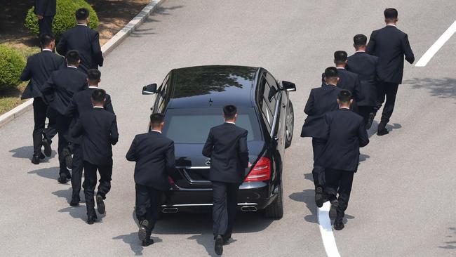 North Korea security guards work hard to earn their keep. Picture: AFP / Korea Summit Press Pool.