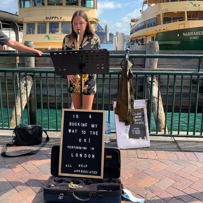 Young girl busking at Circular Quay to help her get to London. #SnapSydney 2018. Picture: Laura Sullivan