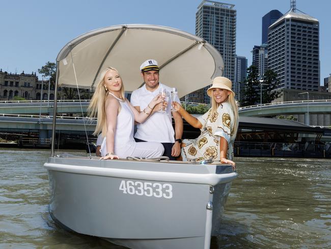 HOLD FOR FUTURE BRISBANE!Jada Cerneka, Alberto Ruiz Lopez and Jacara Desland enjoying a cruise on a GoBoat on the Brisbane River. Picture Lachie Millard