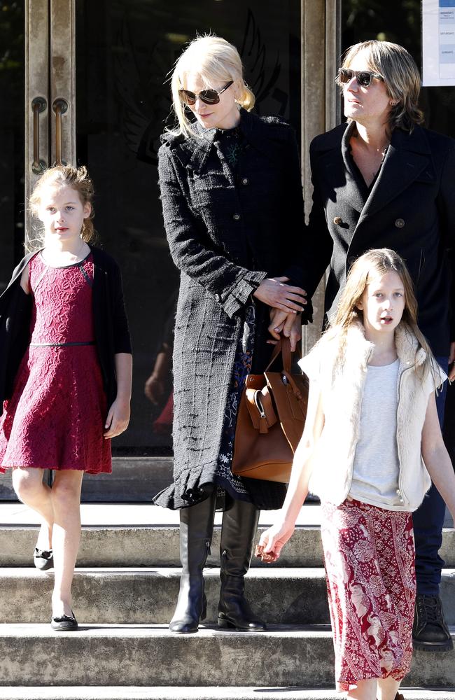 Nicole Kidman affectionately held Keith Urban’s hand as they left the church with their two daughters Faith Margaret and Sunday Rose. Picture: Matrix