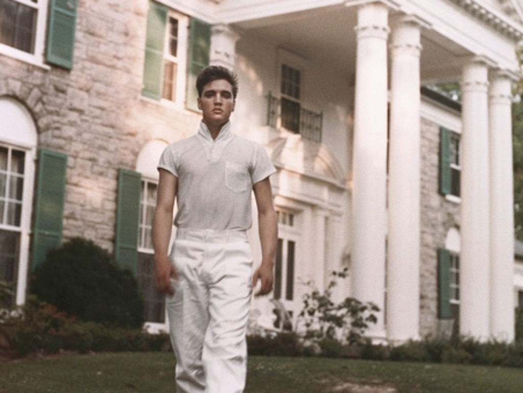 Elvis Presley strolls the grounds of his Graceland estate circa 1957. Picture: supplied