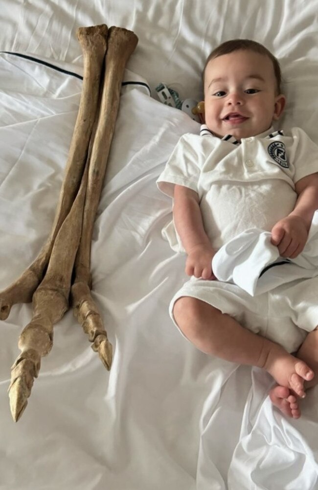 Adrian Portelli’s son Mercy with the T-Rex foot. Picture: Instagram