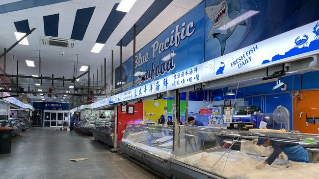 Seafood vendors prepare their stalls at the Preston market hall. Picture: Olivia Condous.