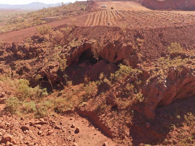 (FILES) This handout file photo taken on May 15, 2020 and released by the PKKP Aboriginal Corporation and received by AFP on May 27, 2020 shows Juukan Gorge in Western Australia -- one of the earliest known sites occupied by Aboriginals in Australia. - Rio Tinto announced the resignation of its CEO and two top lieutenants on September 11, 2020 over the mining giant's destruction of a 46,000-year-old Aboriginal site to expand an iron ore mine in Australia. The Anglo-Australian firm faced a growing investor revolt over the destruction of the sacred site in the Juukan Gorge in Western Australia's remote Pilbara region -- one of the earliest known locations inhabited by Australia's indigenous people. (Photo by Handout / PKKP Aboriginal Corporation / AFP) / RESTRICTED TO EDITORIAL USE - MANDATORY CREDIT "AFP PHOTO / PKKP ABORIGINAL CORPORATION" - NO MARKETING NO ADVERTISING CAMPAIGNS - DISTRIBUTED AS A SERVICE TO CLIENTS - NO ARCHIVES