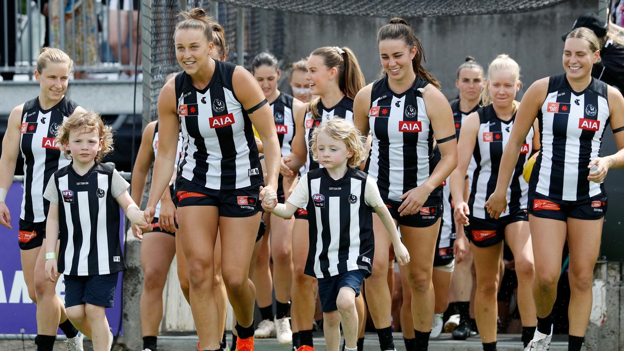 Ruby Schleicher leads the team on to the field at their traditional home at Victoria Park. Picture: Dylan Burns/AFL Photos via Getty Images