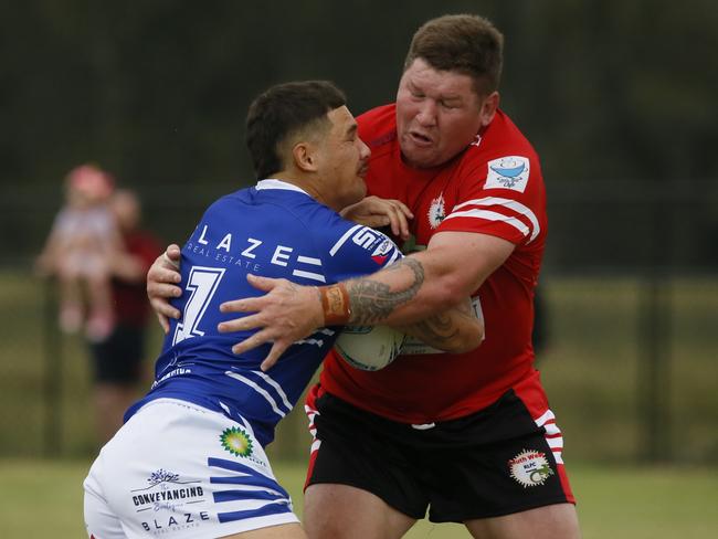 ShaneKIEL is tackled by Greg EastwoodMacarthur Rugby League,   Sunday 17 March.Kirkham Park, Camden Valley Way, Elderslie NSW 2570, Australia, Elderslie NSWMen's First Grade: Narellan v South WestPhotos Warren Gannon Photography