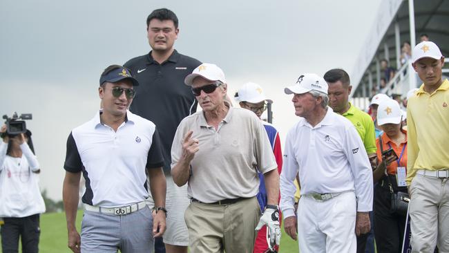 Yao Ming looms large behind Michael Douglas and Gary Player.